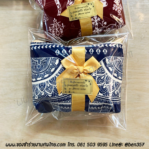 ของชำร่วยงานศพ กระเป๋าสตางค์ใส่เหรียญ ลายช้าง คาดริบบิ้น ใส่ถุงพลาสติกแก้ว 15.-/ ถุงผ้า 20.- / ถุงผ้าโบว์ 21.-
