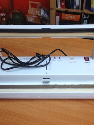 เครื่องซีลสูญญากาศแบบฝาเปิด