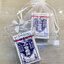ของชำร่วยงานศพ น้ำมันดอกไม้ขาว แปะฮวยอิ้ว ฉลาดน้ำเงิน 5 ml. (KM) ใส่ถุงพลาสติกแก้ว 55.-/ ถุงผ้า 57.-/ ถุงผ้าติดโบว์ 58.-